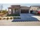 Single-story home with stone accents and a two-car garage at 20487 W Minnezona Ave, Buckeye, AZ 85396