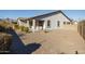 Single story home with backyard patio and gravel landscaping at 20487 W Minnezona Ave, Buckeye, AZ 85396