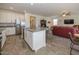 Open kitchen with island, stainless steel appliances, and granite countertops at 20487 W Minnezona Ave, Buckeye, AZ 85396