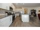 Modern kitchen with white cabinets and granite countertops at 20487 W Minnezona Ave, Buckeye, AZ 85396