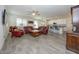 Open living room with leather sofas and a wood coffee table at 20487 W Minnezona Ave, Buckeye, AZ 85396