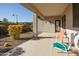Outdoor patio area with seating and desert landscape at 20487 W Minnezona Ave, Buckeye, AZ 85396