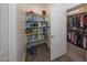 Storage room with shelving and closet for extra storage at 20487 W Minnezona Ave, Buckeye, AZ 85396