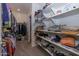 Large walk-in closet offers custom shelving and storage at 20487 W Minnezona Ave, Buckeye, AZ 85396