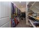 Spacious walk-in closet with ample shelving and hanging space at 20487 W Minnezona Ave, Buckeye, AZ 85396