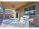 Covered patio with a built-in grill and ceiling fan at 23919 N 23Rd Pl, Phoenix, AZ 85024