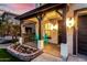 Charming front porch with teal chairs and beautiful landscaping at 25320 N 52Nd Ave, Phoenix, AZ 85083