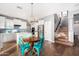 Modern kitchen with white cabinets and a breakfast nook at 25320 N 52Nd Ave, Phoenix, AZ 85083