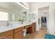 Elegant bathroom with dual sinks and a large mirror at 25564 W Ripple Rd, Buckeye, AZ 85326