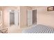 Bright bedroom with access to a private bathroom and walk in closet at 25564 W Ripple Rd, Buckeye, AZ 85326