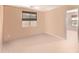 Light and airy bedroom with neutral walls and carpeting at 25564 W Ripple Rd, Buckeye, AZ 85326