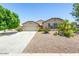 Single-story house with a landscaped front yard and a two-car garage at 25564 W Ripple Rd, Buckeye, AZ 85326