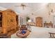 Living room with high ceilings, wooden cabinets, and a cozy atmosphere at 26209 S Greencastle Dr, Sun Lakes, AZ 85248