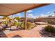 Relaxing covered patio with seating and view of the backyard at 26209 S Greencastle Dr, Sun Lakes, AZ 85248