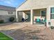 Covered patio with seating and a view of the backyard at 36457 W Picasso St, Maricopa, AZ 85138