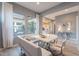 Stylish dining area with modern furniture, backyard view, and easy access to the kitchen at 36925 N Stoneware Dr, Queen Creek, AZ 85140