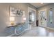 Light and bright entryway featuring modern décor and a glass decorative door with a side window at 36925 N Stoneware Dr, Queen Creek, AZ 85140