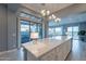 Bright kitchen with a large island, modern appliances, and seamless access to the outdoor patio at 36925 N Stoneware Dr, Queen Creek, AZ 85140