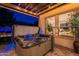 Outdoor patio area showcasing a luxurious hot tub and a grill at 36925 N Stoneware Dr, Queen Creek, AZ 85140