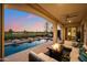Stunning pool and patio area with fire pit and seating at 36925 N Stoneware Dr, Queen Creek, AZ 85140