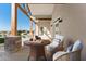 Relaxing patio with wicker furniture and mountain views at 39015 N 6Th Dr, Phoenix, AZ 85086