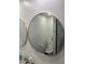 Bathroom with toilet and large round mirror at 4016 W Wagon Wheel Dr, Phoenix, AZ 85051