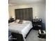 Main bedroom with a plush bed and ample nightstands at 4016 W Wagon Wheel Dr, Phoenix, AZ 85051