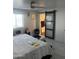 Bright bedroom with king-size bed and barn door at 4016 W Wagon Wheel Dr, Phoenix, AZ 85051
