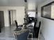 Modern dining area with glass table and black chairs at 4016 W Wagon Wheel Dr, Phoenix, AZ 85051