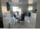 Modern dining area with glass table and black chairs at 4016 W Wagon Wheel Dr, Phoenix, AZ 85051