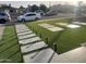 Artificial turf lawn with a stone walkway and lighting at 4016 W Wagon Wheel Dr, Phoenix, AZ 85051