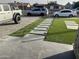 Artificial turf and stone pathway with landscape lighting at 4016 W Wagon Wheel Dr, Phoenix, AZ 85051