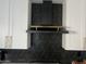 Sleek kitchen with black range hood, geometric backsplash and white cabinets at 4016 W Wagon Wheel Dr, Phoenix, AZ 85051