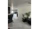 Open living room with modern fireplace and kitchen view at 4016 W Wagon Wheel Dr, Phoenix, AZ 85051