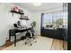 Home office with a desk, chair, and built-in shelving at 4601 E Desert Cactus St, Phoenix, AZ 85032