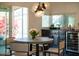 Modern dining area with round table and black cabinetry at 5444 E Virginia Ave, Phoenix, AZ 85008