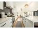 Modern kitchen with white cabinets and quartz countertops at 5444 E Virginia Ave, Phoenix, AZ 85008