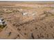 Aerial view of a house and lot in a desert setting at 55215 W La Barranca Dr, Maricopa, AZ 85139