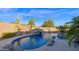 Luxury pool with waterfall feature and desert landscaping at 5650 E Villa Cassandra Way, Carefree, AZ 85377