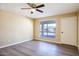 Spacious bedroom with hardwood floors and ceiling fan at 625 E Judi Dr, Casa Grande, AZ 85122