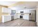 Updated kitchen boasts white cabinets, stainless steel appliances and quartz countertops at 625 E Judi Dr, Casa Grande, AZ 85122