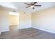Bright living room with hardwood floors and ceiling fan at 625 E Judi Dr, Casa Grande, AZ 85122