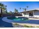 Kidney shaped pool with surrounding patio at 625 E Judi Dr, Casa Grande, AZ 85122