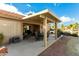 Covered patio with seating area and desert landscaping at 6601 S Oakmont Dr, Chandler, AZ 85249