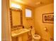 Powder room with pedestal sink and decorative mirror at 7571 E Valley View Trl, Carefree, AZ 85377