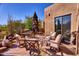 Relaxing patio with comfortable seating and a fire pit at 7571 E Valley View Trl, Carefree, AZ 85377