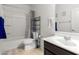 Bathroom with tub, shower, and dark vanity at 8209 W Lane Ave, Glendale, AZ 85303