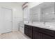 Bathroom with double vanity and a walk-in shower at 8209 W Lane Ave, Glendale, AZ 85303
