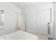 Bedroom with double doors and a mirrored closet at 8209 W Lane Ave, Glendale, AZ 85303