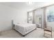 Spacious bedroom with a plush bed and large mirror at 8209 W Lane Ave, Glendale, AZ 85303